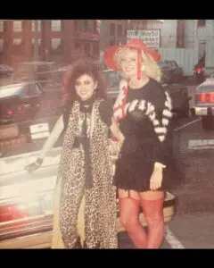 Two women in 1980s punk-glam outfits