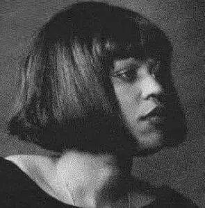 Grayscale profile portrait of person with bob