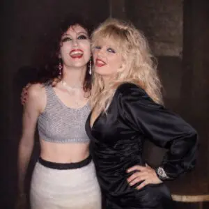 Two smiling women posing together